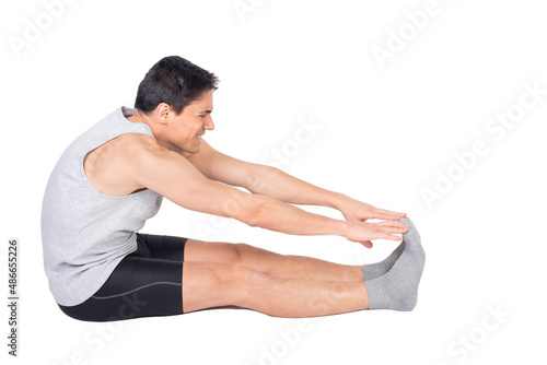 Determined man in sportive wear stretching hamstrings photo