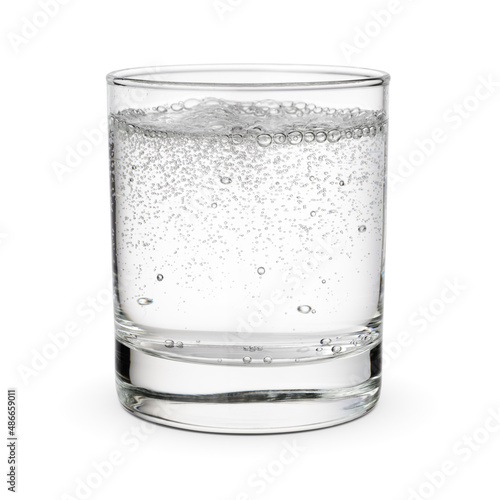 Glass of sparkling water isolated white.