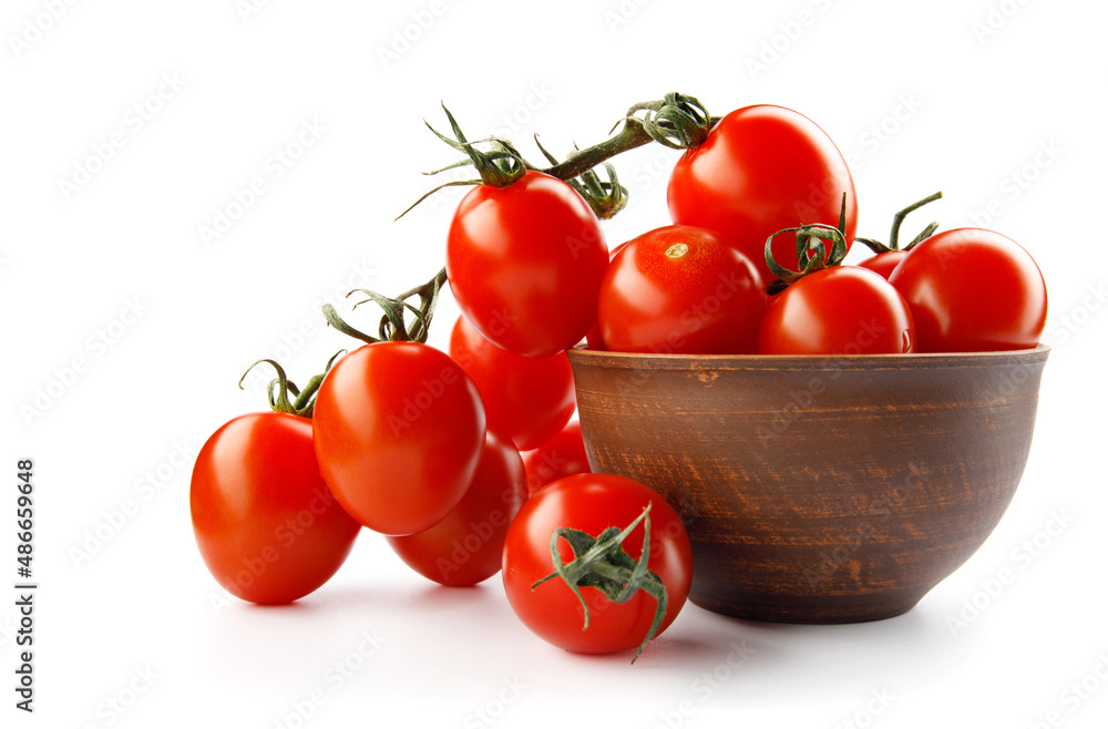 Ripe red tomatoes in a ceramic cup isolated on white background. Ripe red tomatoes in a ceramic cup isolated on white background.