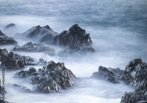 Water with rock nature photo with long exposure fog effect abstract color ocean background 