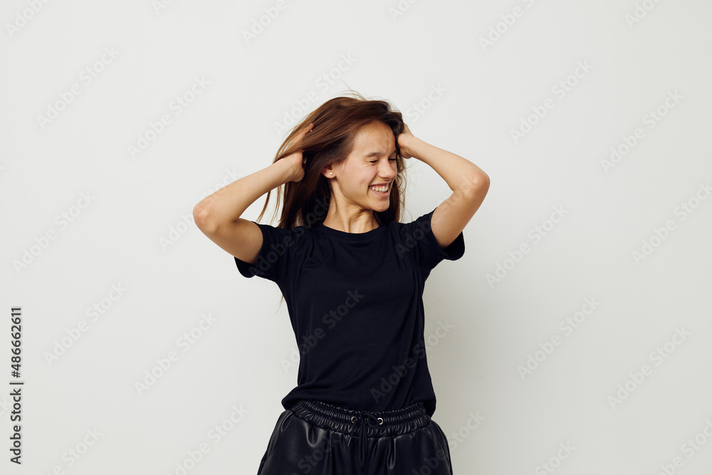 young beautiful woman in a black t-shirt hand gesture fun Lifestyle unaltered young beautiful woman in a black t-shirt hand gesture fun Lifestyle unaltered
