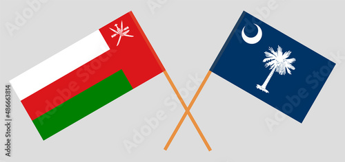 Crossed flags of Oman and The State of South Carolina. Official colors. Correct proportion