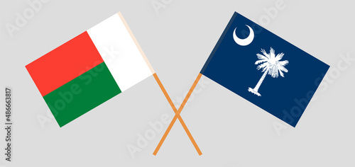 Crossed flags of Madagascar and The State of South Carolina. Official colors. Correct proportion