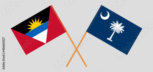 Crossed flags of Antigua and Barbuda and The State of South Carolina. Official colors. Correct proportion
