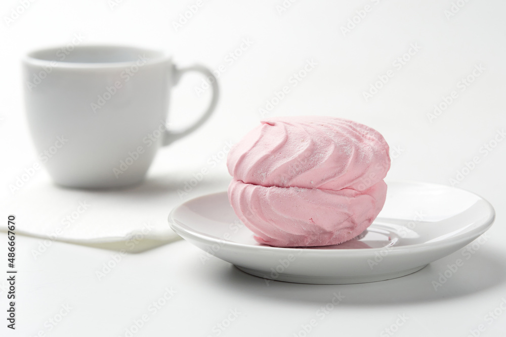 Dessert. Pink marshmallow on a white background. Dessert. Pink marshmallow on a white background.