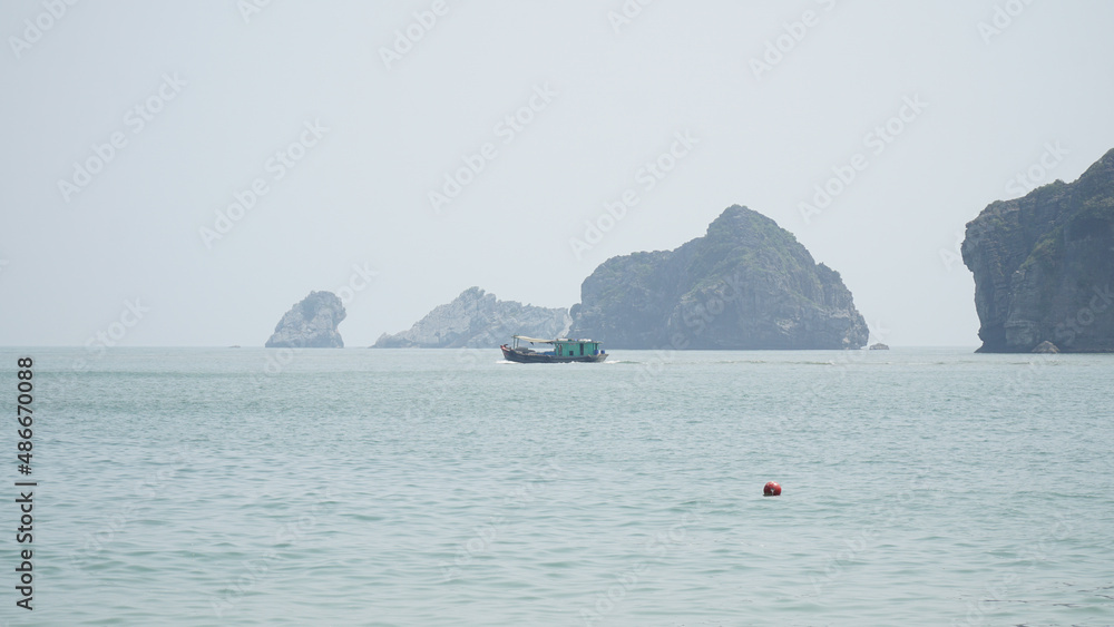 Ha Long Bay mountains rising out of the water in Vietnam. Ha Long Bay mountains rising out of the water in Vietnam.