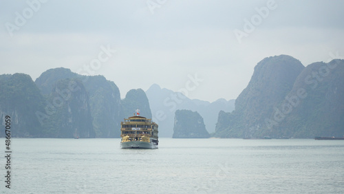 Ha Long Bay mountains rising out of the water in Vietnam. photo