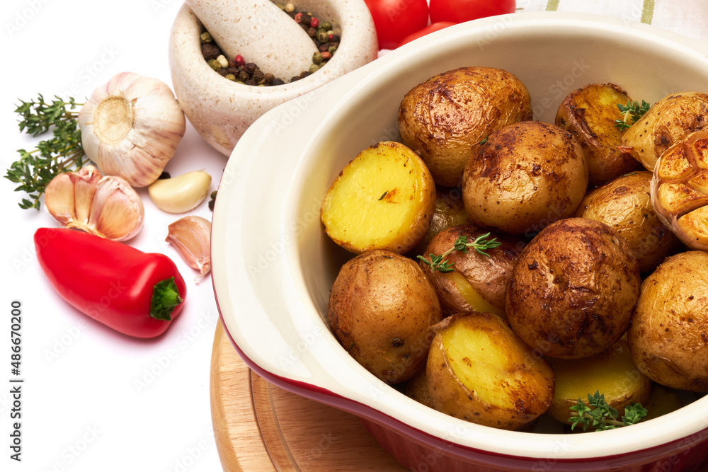 Baked potato in a clay pot isolated on white background Baked potato in a clay pot isolated on white background