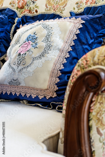 Detail image of Pillows on an antique luxury sofa photo