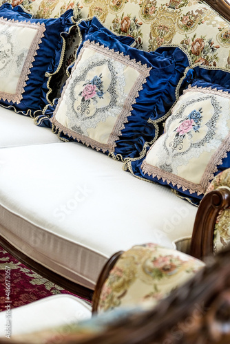 Detail image of Pillows on an antique luxury sofa photo