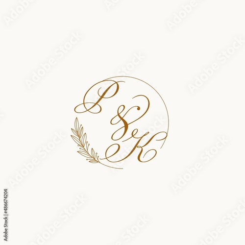 Initials PK wedding monogram logo with leaves and elegant circular lines