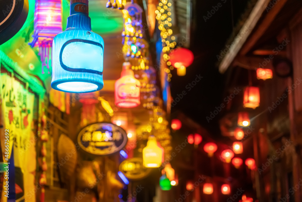 The luminous lighting of bars in the ancient town