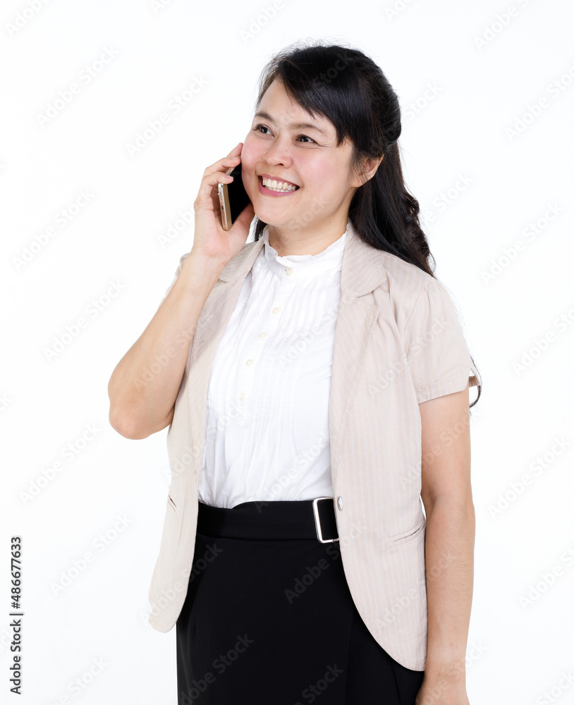 Studio cutout isolated closeup shot of Asian young female businesswoman secretary standing smiling holding smartphone mobile on white background. Studio cutout isolated closeup shot of Asian young female businesswoman secretary standing smiling holding smartphone mobile on white background.
