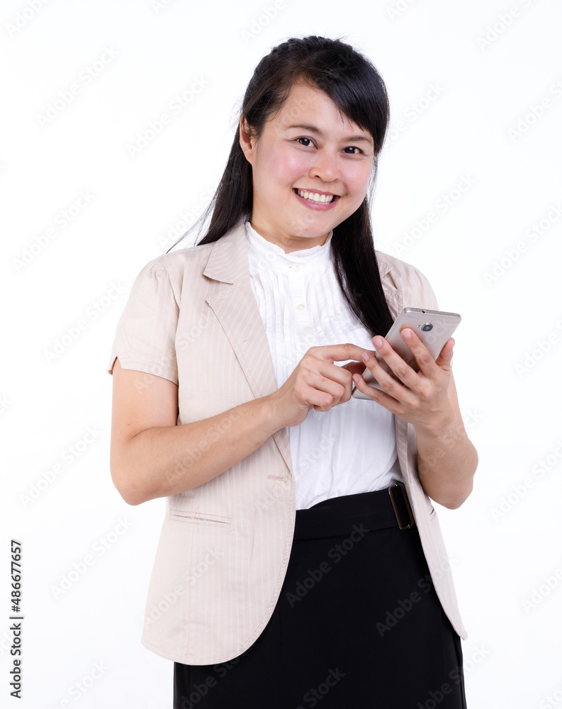 Studio cutout isolated closeup shot of Asian young female businesswoman secretary standing smiling holding smartphone mobile on white background. Studio cutout isolated closeup shot of Asian young female businesswoman secretary standing smiling holding smartphone mobile on white background.