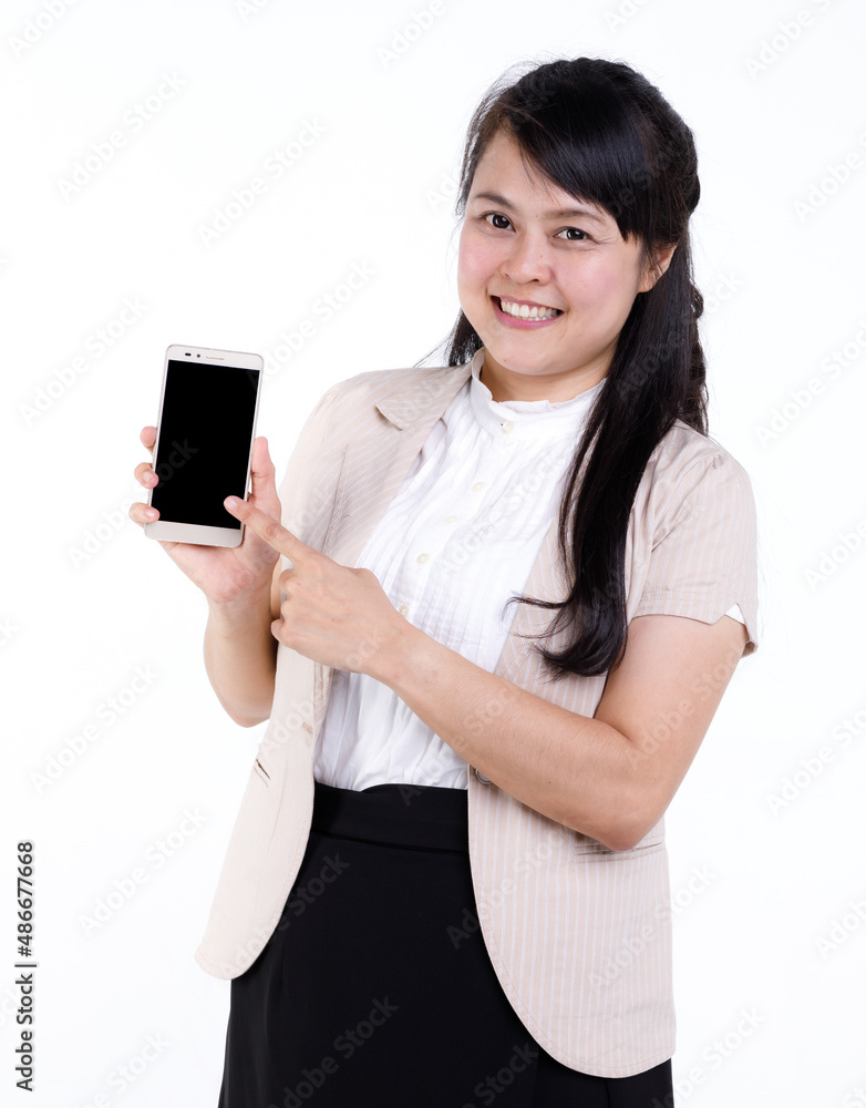 Studio cutout isolated closeup shot of Asian young female businesswoman secretary standing smiling holding smartphone mobile on white background. Studio cutout isolated closeup shot of Asian young female businesswoman secretary standing smiling holding smartphone mobile on white background.