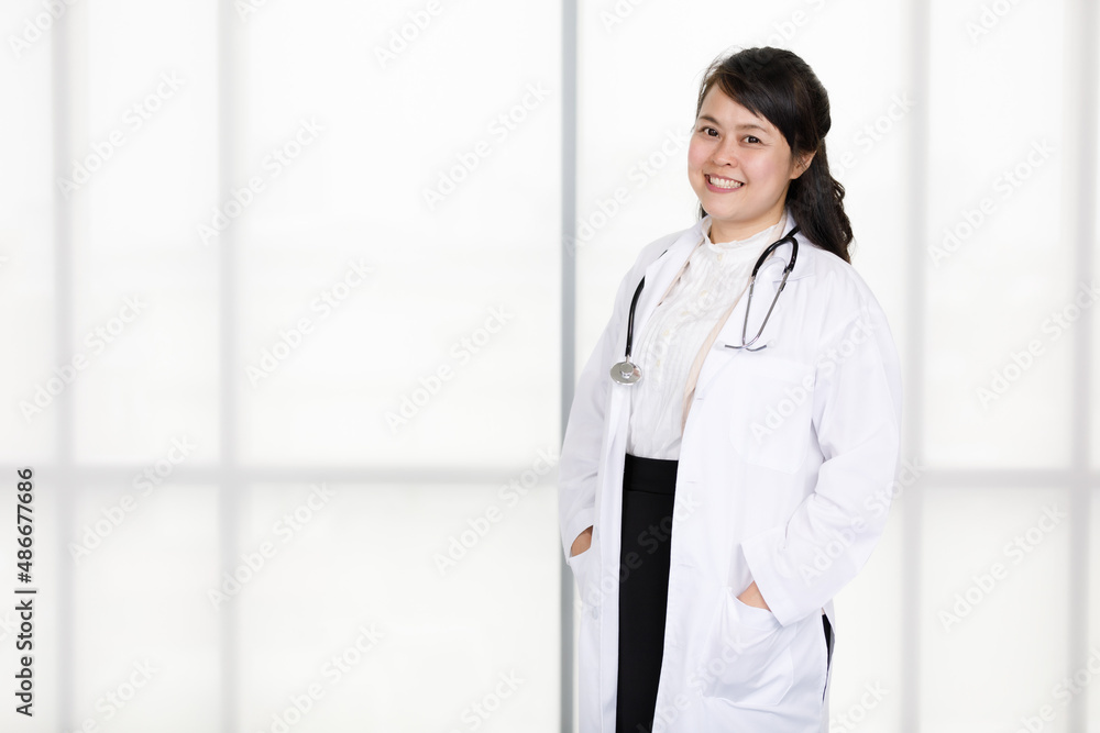 Portrait shot of Asian young happy professional successful experienced female doctor in white lab coat uniform with stethoscope standing on floor posing smiling look at camera Portrait shot of Asian young happy professional successful experienced female doctor in white lab coat uniform with stethoscope standing on floor posing smiling look at camera