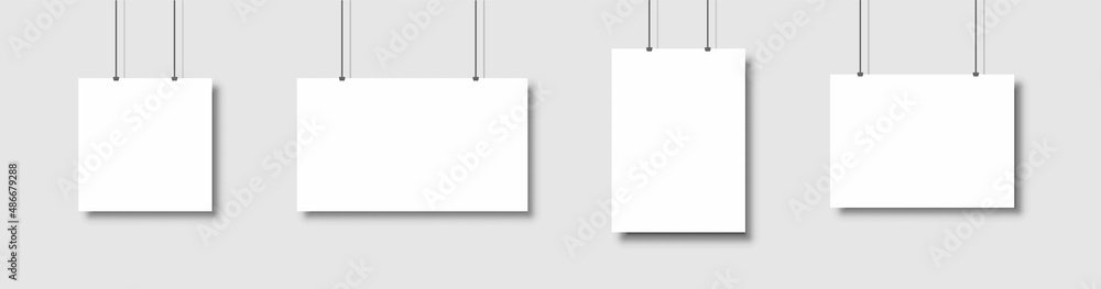 Template of white blank vector posters. Set of mockups hanging on the wall. Frame for paper sheet. Isolated on gray background illustration Template of white blank vector posters. Set of mockups hanging on the wall. Frame for paper sheet. Isolated on gray background illustration