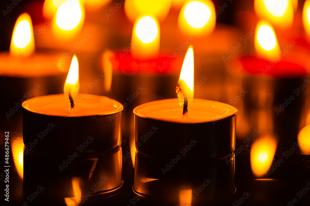 candle,Many candles burn with a shallow depth of field,Burning candles in darkness candle,Many candles burn with a shallow depth of field,Burning candles in darkness
