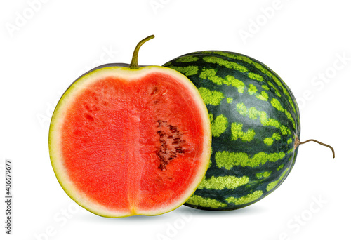 Ripe round watermelon and cut watermelon slice with red pulp