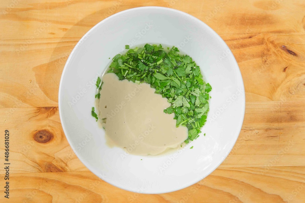 Nut and parsley sauce on rustic background .Copy space Nut and parsley sauce on rustic background .Copy space