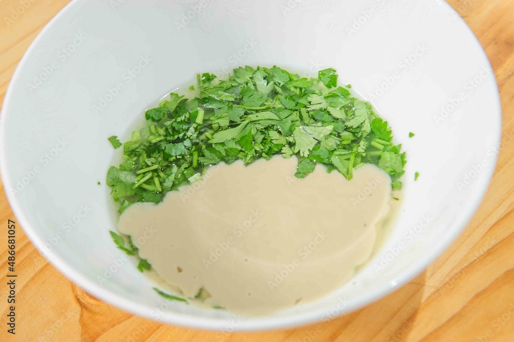 Nut and parsley sauce on rustic background .Copy space Nut and parsley sauce on rustic background .Copy space