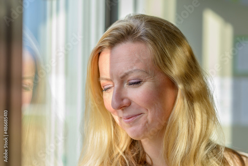 Preoccupied worried woman looking down Free Download Preoccupied worried woman looking down - GFXLoad