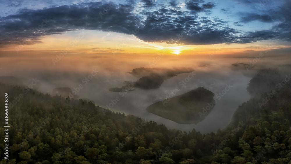 Morning at polish Lake Wigry with fog and sun at Bryzgiel Morning at polish Lake Wigry with fog and sun at Bryzgiel