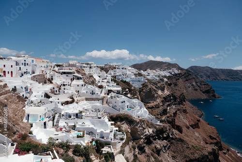 White architecture on Santorini island with view on the sea, Oia, Greece. Summer vacation and holiday concept, luxury travel. Wonderful scenery, cruise ships and white architecture. Amazing landscape. © Yelyzaveta Kras