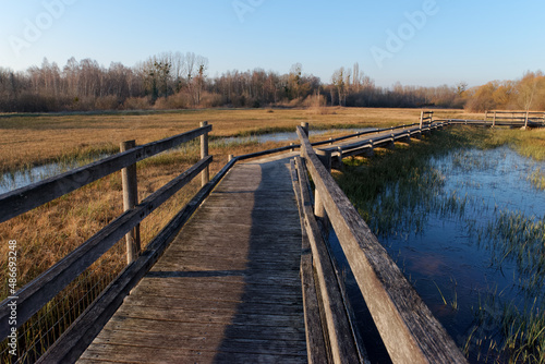 Wooden footpath on wet meadow in the Episy Sensitive Natural Space. French Gatinais Regional Nature Park © hassan bensliman