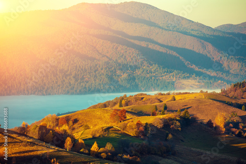 Fantastic view of the mountains above the clouds on an autumn morning