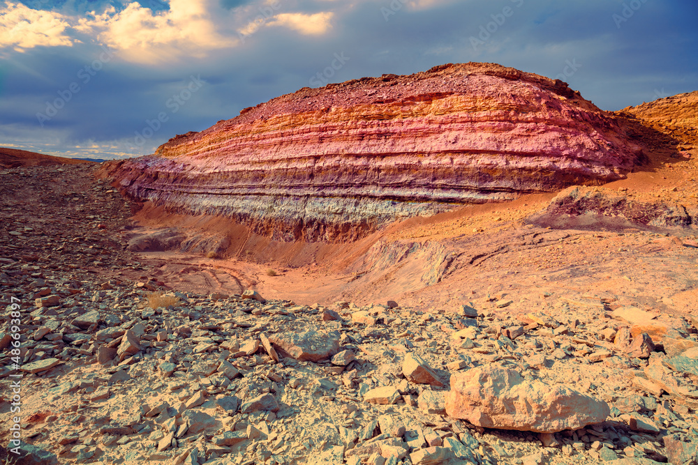 Mountain desert landscape. Colorful sandstone mount in National Park Makhtesh Ramon Crater in Negev desert, Israel