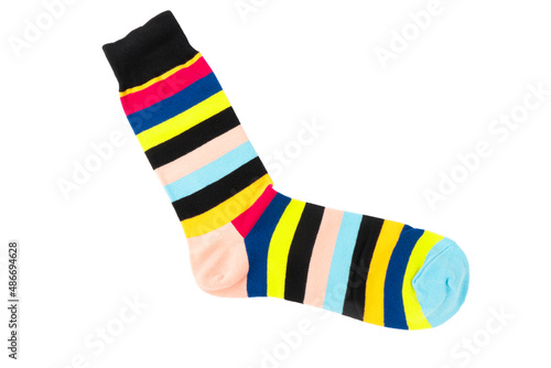 One sock with different lines isolated on white background. Colorful sock son white background. Colored socks on the leg isolated on white background