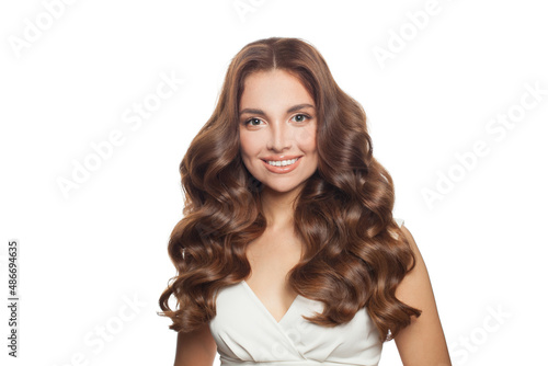 Beautiful curly hair model. Cute woman with wavy long hair isolated on white background portrait