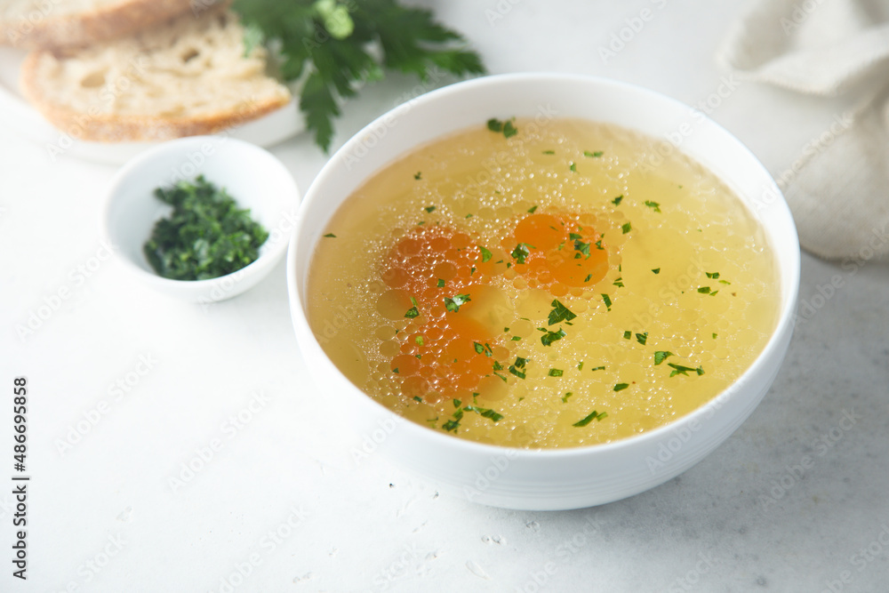 Traditional homemade chicken stock with vegetables Traditional homemade chicken stock with vegetables