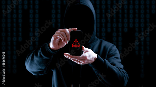 Cyber security hacker smartphone. Internet web hack technology. Digital mobile phone in hacker man hand isolated on black banner. Data protection, secured internet access, cybersecurity.