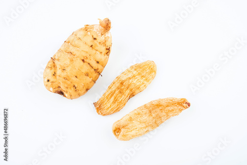 Fresh and dried Gastrodia elata on white background photo