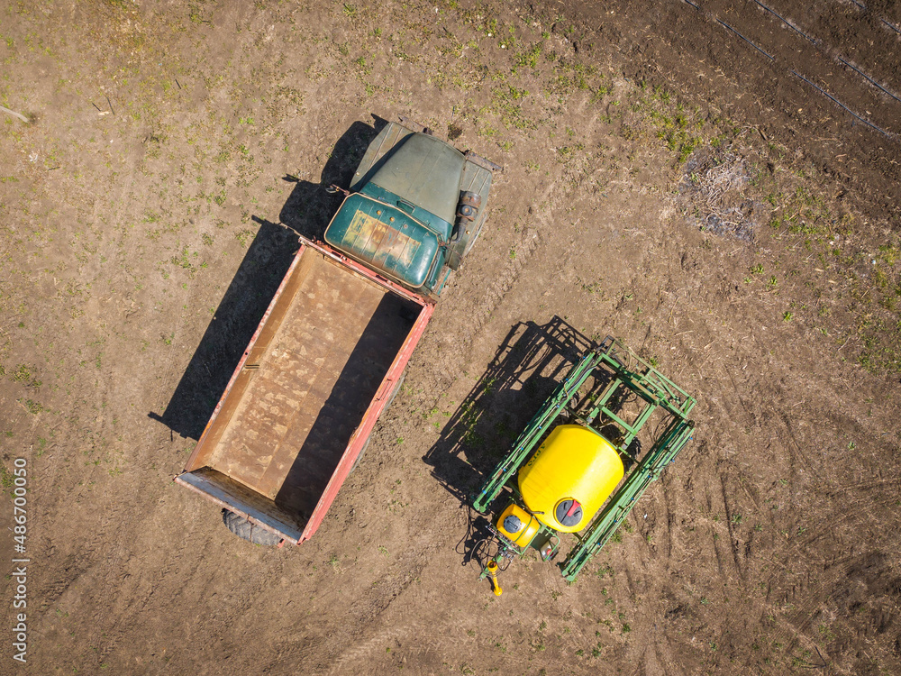 Aerial top down drone shot. Old truck and sprinkler.