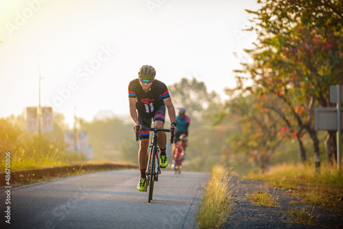 cyclist leads in action,Front view man riding bicycle in the racing road