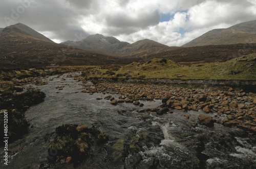 mountain stream with Cuillins in background, Isle of Skye, Scotland UK