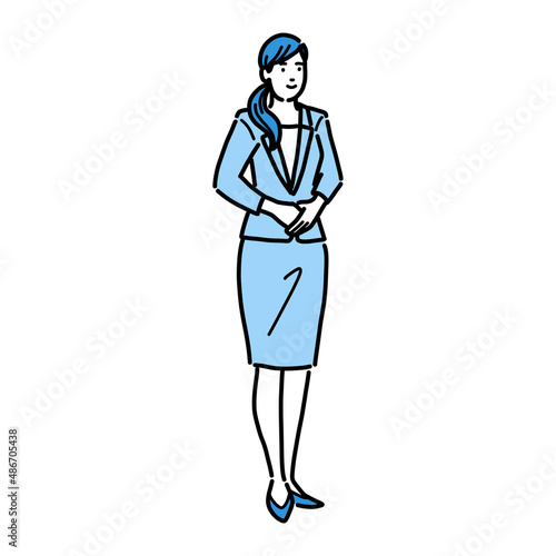 立っている全身のスーツを着た女性
