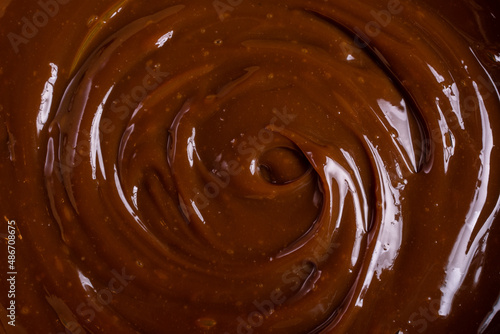 Tasty chocolate cream or sweet caramel sauce background