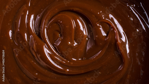 Tasty chocolate cream or sweet caramel sauce background