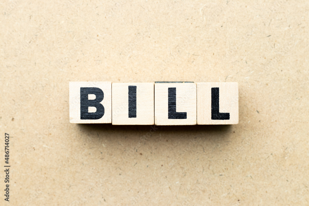 Obraz premium Alphabet letter block in word bill on wood background