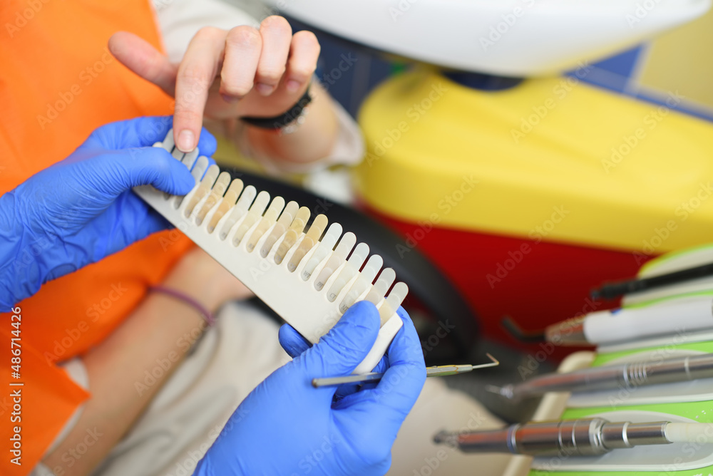 custom made wallpaper toronto digitalthe dentist selects the right shade of teeth on special equipment.