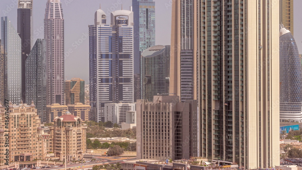 Row of the tall buildings around Sheikh Zayed Road and DIFC district aerial all day timelapse in Dubai Row of the tall buildings around Sheikh Zayed Road and DIFC district aerial all day timelapse in Dubai