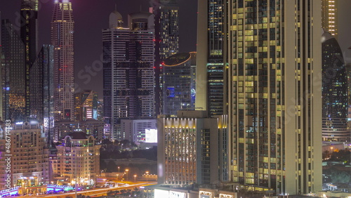 Row of the tall buildings around Sheikh Zayed Road and DIFC district aerial night timelapse in Dubai © neiezhmakov