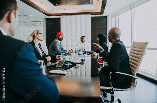 Canvas Print Cinematic image of a multiethnic business team working together in Dubai in offices