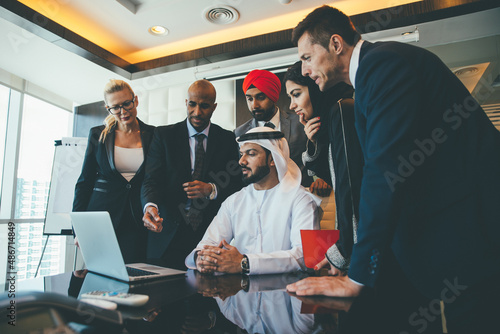 Photography Cinematic image of a multiethnic business team working together in Dubai in offices