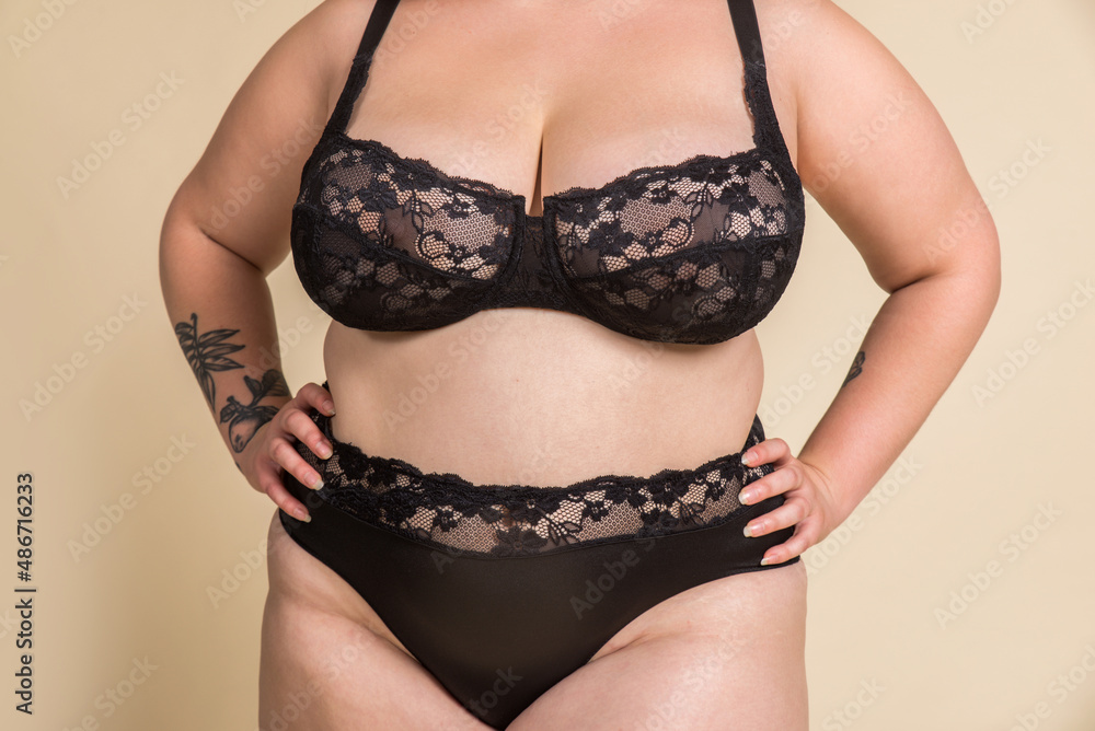Plus size woman posing for body acceptance Plus size woman posing for body acceptance
