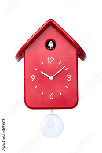 Red cuckoo clock with white pendulum isolated 